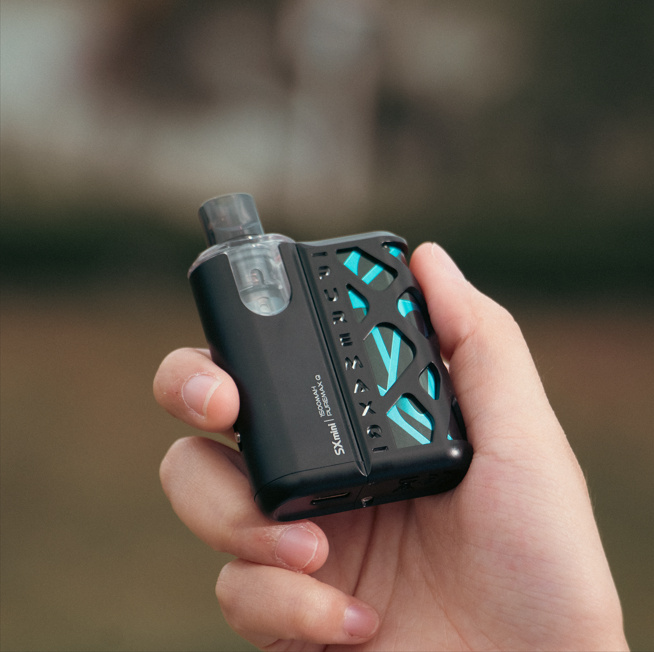 SX Mini PureMax kit held in a woman's hand