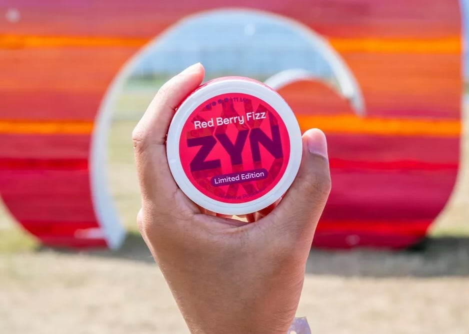 holding up a zyn nic pouch can